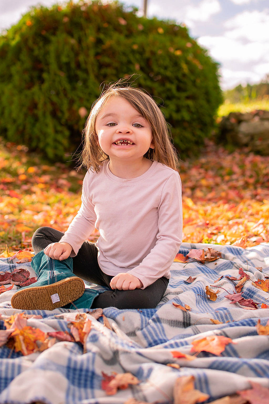 Zoie is registered to the contest to win money with this photo: child, dress, eye, flash_photography, fun, grass, hair, happy, head, joy, leisure, orange, pattern, people_in_nature, person, plant, recreation, sitting, smile, sunlight