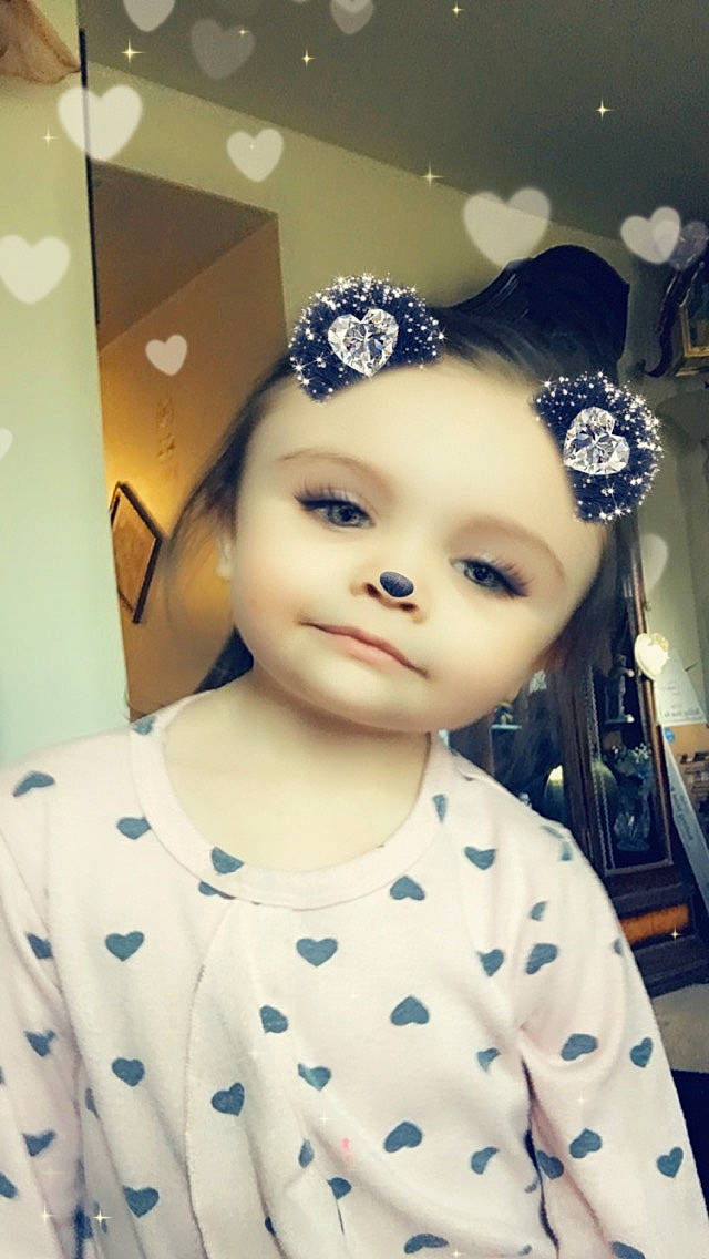 Zoie is registered to the contest to win money with this photo: baby_toddler_clothing, eyebrow, eyelash, fashion_accessory, fashion_design, flash_photography, happy, hat, headband, headgear, headpiece, jewellery, lip, pattern, person, selfie, sleeve, smile, toddler, toy