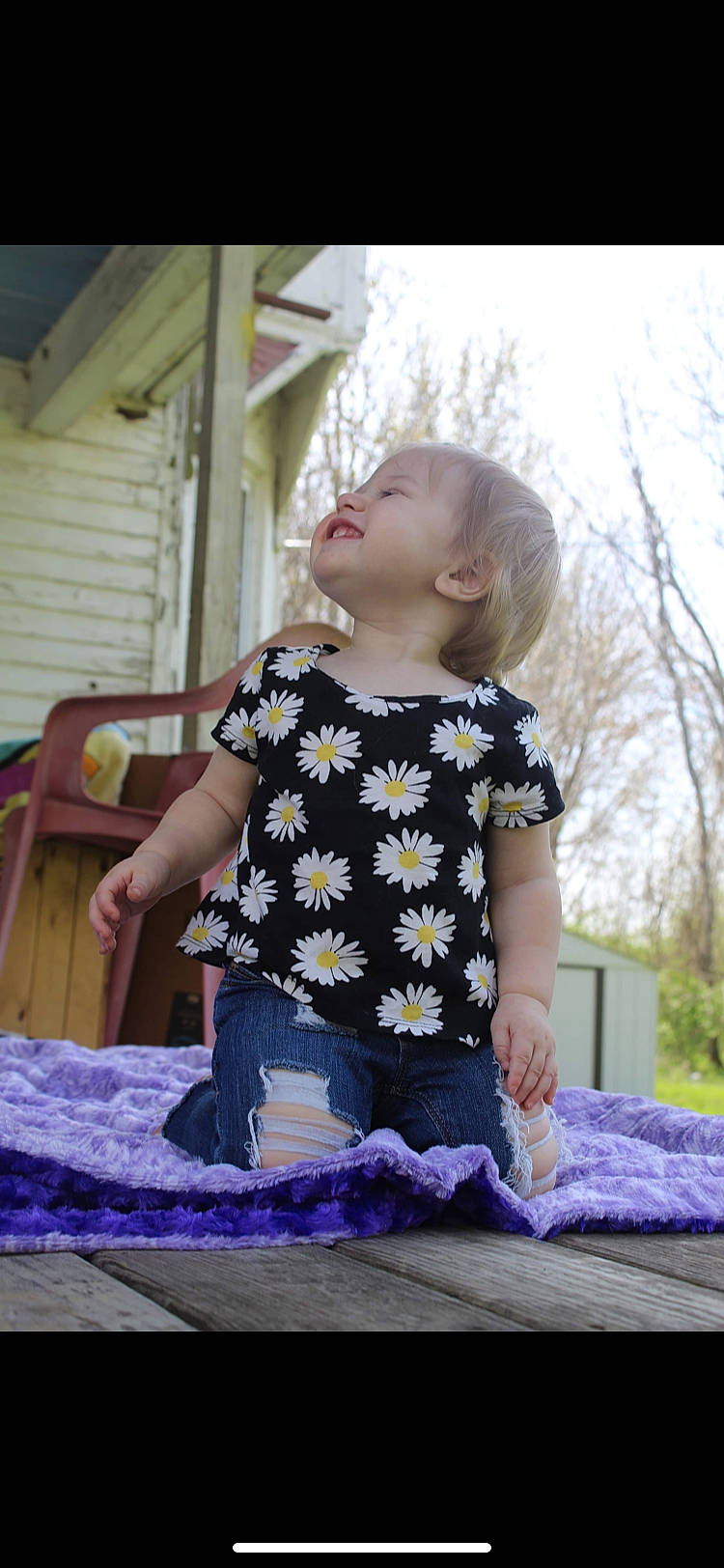 Adalynn is registered to the contest to win money with this photo: baby_toddler_clothing, chair, child, dress, fun, grass, happy, leisure, magenta, pattern, person, plant, purple, recreation, sitting, sky, sleeve, street_fashion, t_shirt, toddler