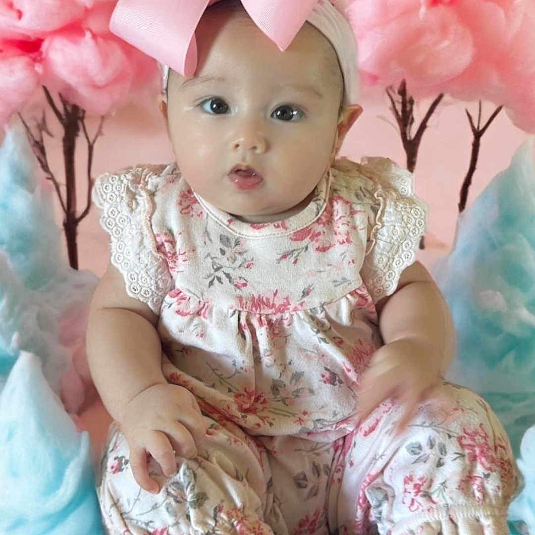 Margaret is registered to the contest to win money with this photo: accessories, baby, balloon, clothing, costume, dress, face, flower, hat, head, homedecor, newborn, people, person, petal, photography, plant, portrait, sitting, toy