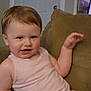 Meradith joined the competition — help win amazing prizes! toddler, child, couch, indoor, casual, pink_shirt, hair, face, smile, living_room, television, screen, furniture, relaxing, person, young_child, home, seated, expression, skin
