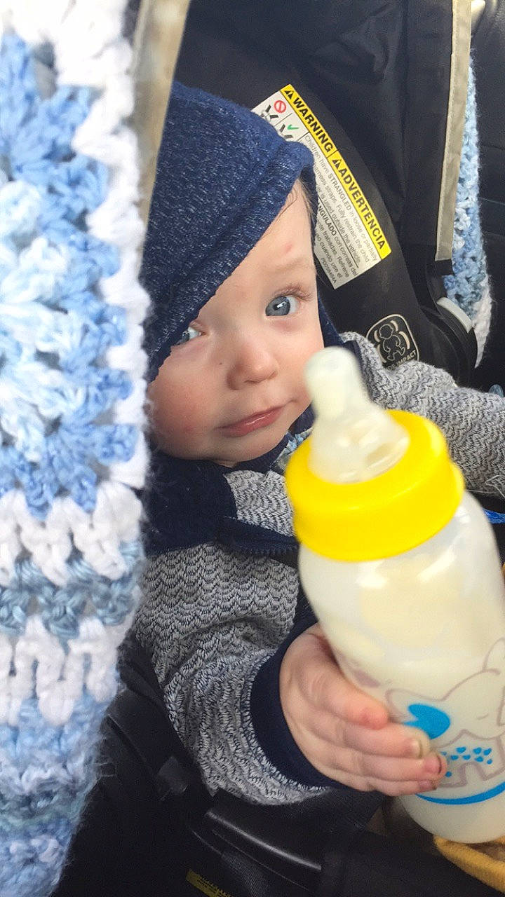 Castiel is registered to the contest to win money with this photo: baby, baby_bottle, baby_products, baby_toddler_clothing, bottle, cap, child, drink, drinking, drinkware, hand, happy, headwear, milk, outerwear, person, plastic_bottle, product, skin, toddler