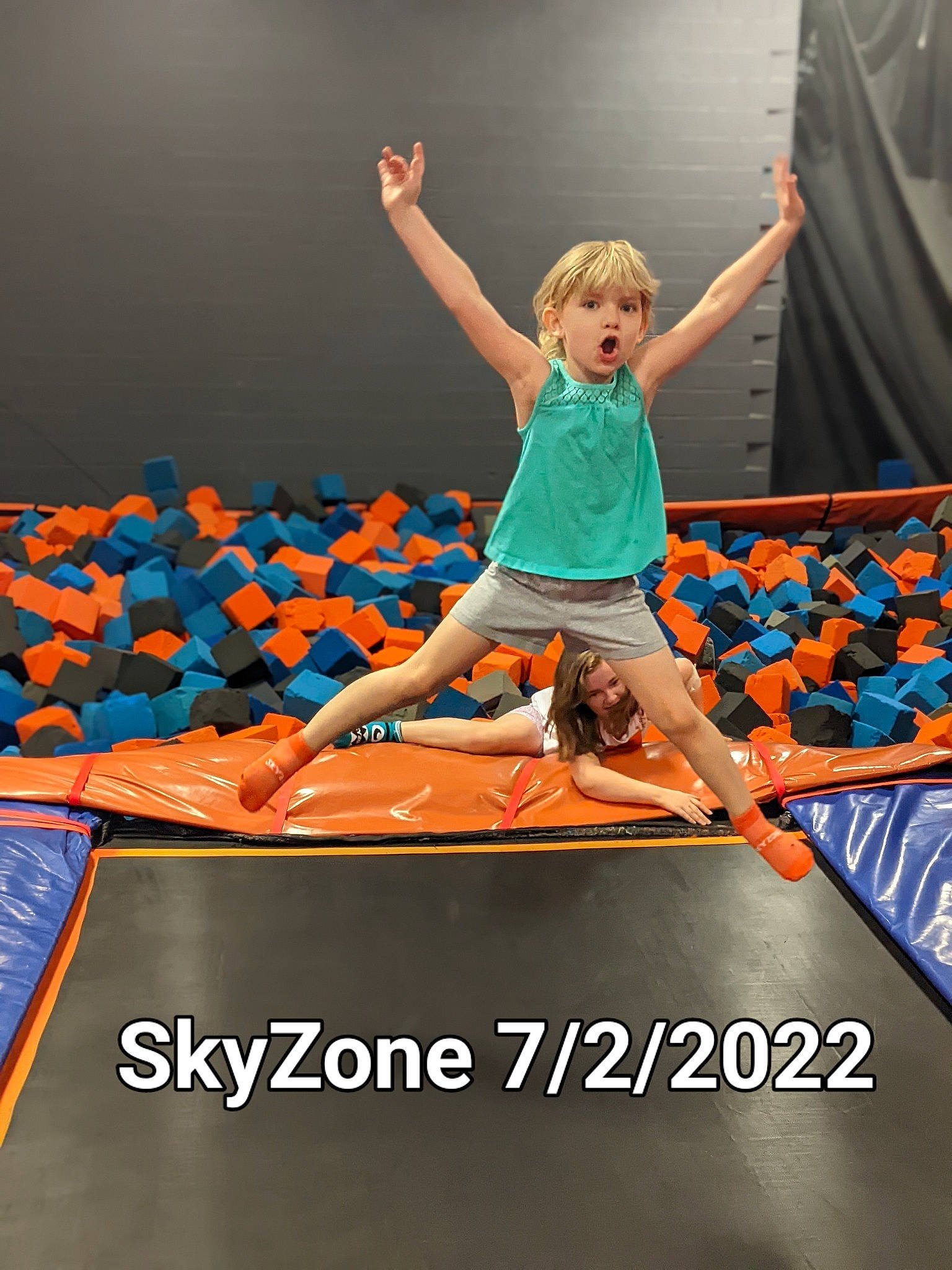 Ericka is registered to the contest to win money with this photo: balance, child, electric_blue, entertainment, event, fashion, font, fun, happy, leisure, performing_arts, person, physical_fitness, recreation, sportswear, surprise, t_shirt, textile, toddler, trampoline