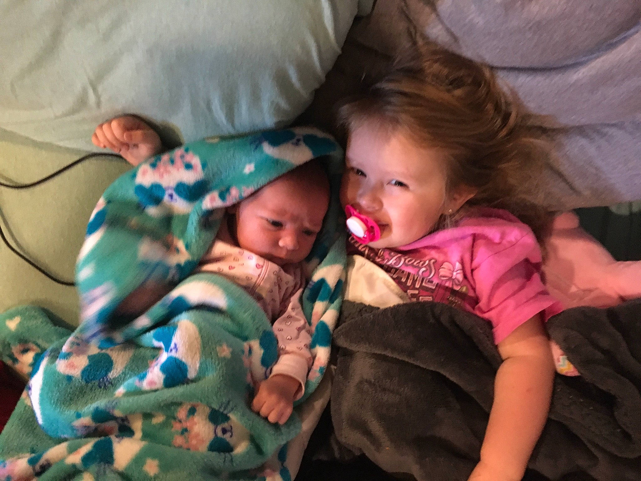 Bethany is registered to the contest to win money with this photo: arm, baby, baby_products, baby_toddler_clothing, camouflage, child, comfort, lap, linens, military_camouflage, nose, person, toddler