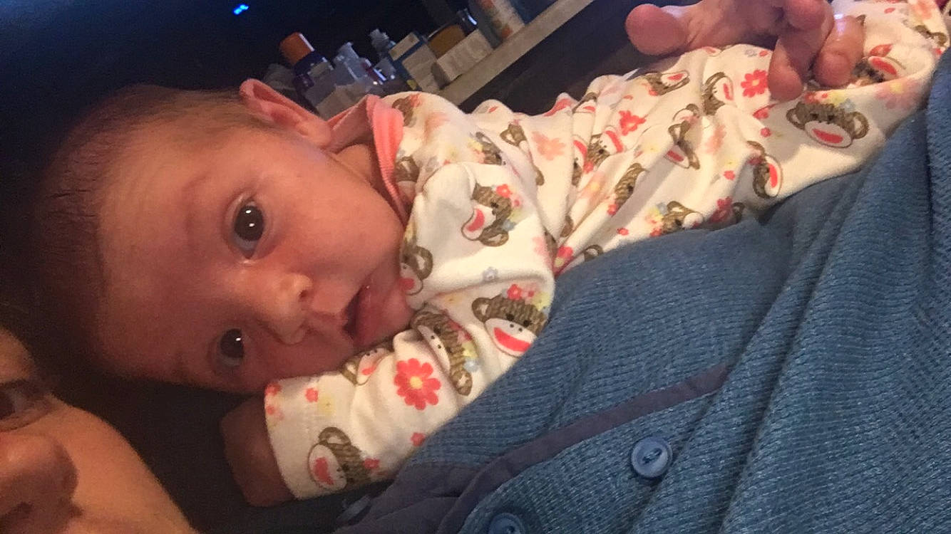 Chloe is registered to the contest to win money with this photo: baby, baby_products, baby_toddler_clothing, cheek, child, comfort, eyebrow, eyelash, finger, flesh, human, lip, muscle, nail, person, skin, thumb, toddler