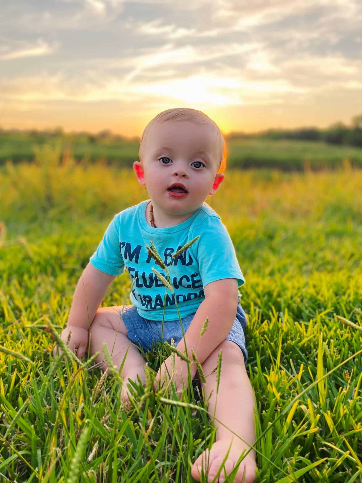 Kolten is registered to the contest to win money with this photo: baby, baby_toddler_clothing, cloud, flash_photography, fun, grass, grass_family, grassland, happy, leaf, light, meadow, people_in_nature, person, plant, skin, sky, summer, sunlight, surprise