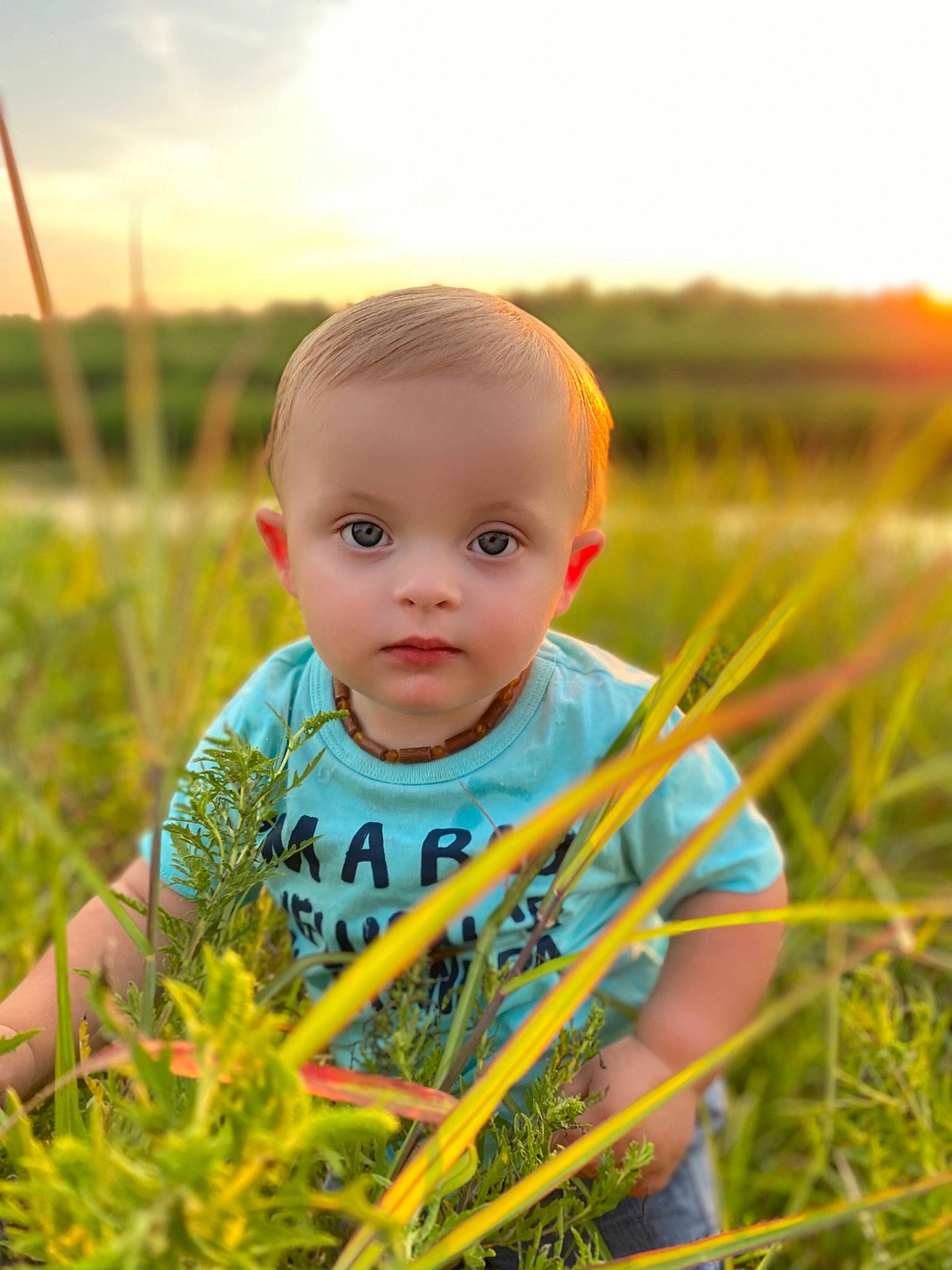 Kolten is registered to the contest to win money with this photo: baby, baby_toddler_clothing, child, cloud, flash_photography, fun, grass, grass_family, grassland, happy, iris, landscape, leisure, meadow, people_in_nature, person, plant, sky, summer, sunlight