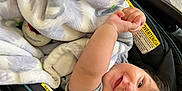 Abel joined the competition — help win amazing prizes! baby, blanket, stroller, child, smiling, happy, infant, face, clothing, arm, hair, indoor, cute, person, seat, comfort, infantwear, babycare, relaxation, playful