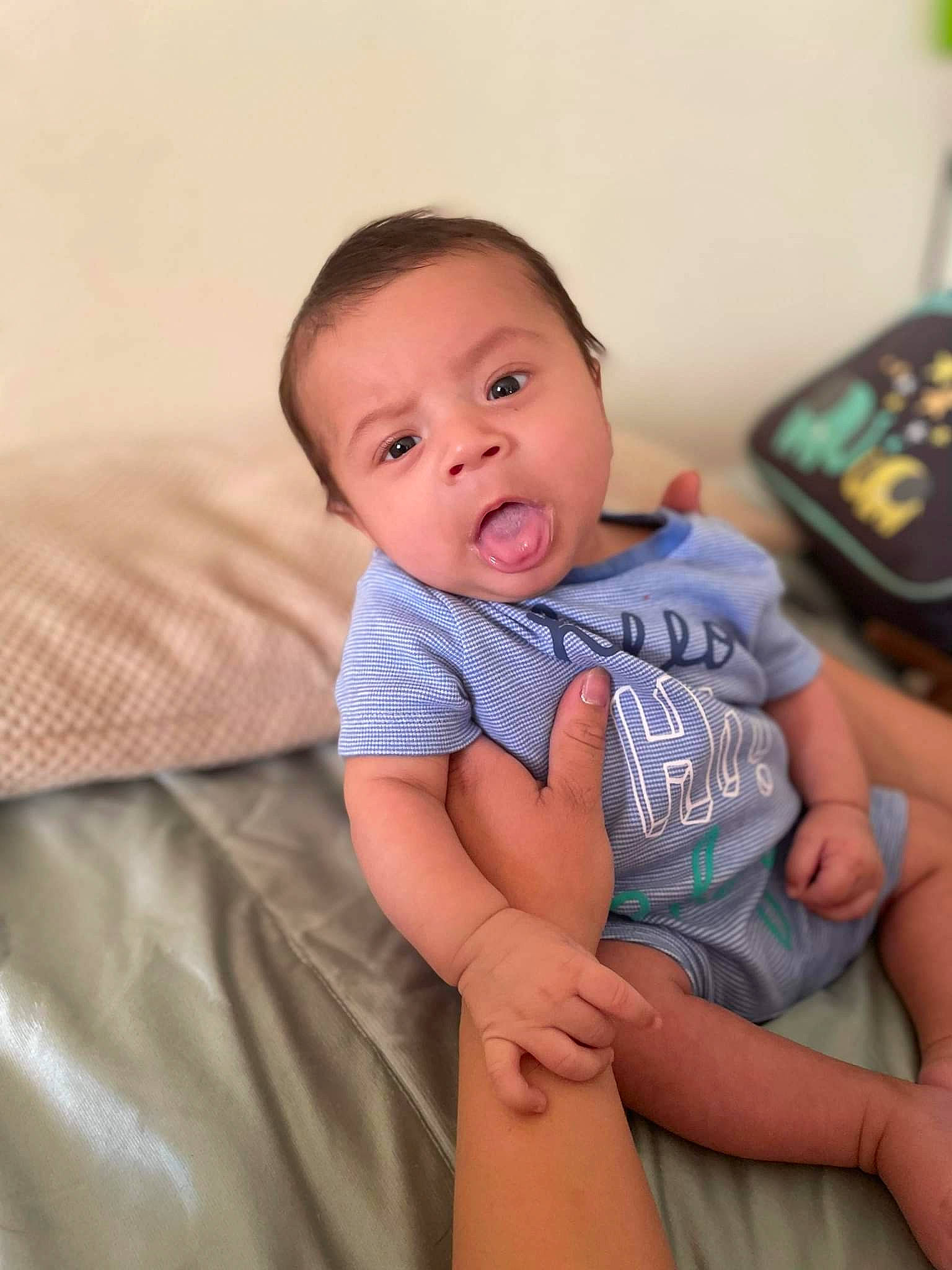 Ricardo is registered to the contest to win money with this photo: baby, baby_toddler_clothing, cheek, child, chin, comfort, elbow, eye, face, finger, happy, iris, joint, lip, neck, nose, person, skin, sleeve, thigh