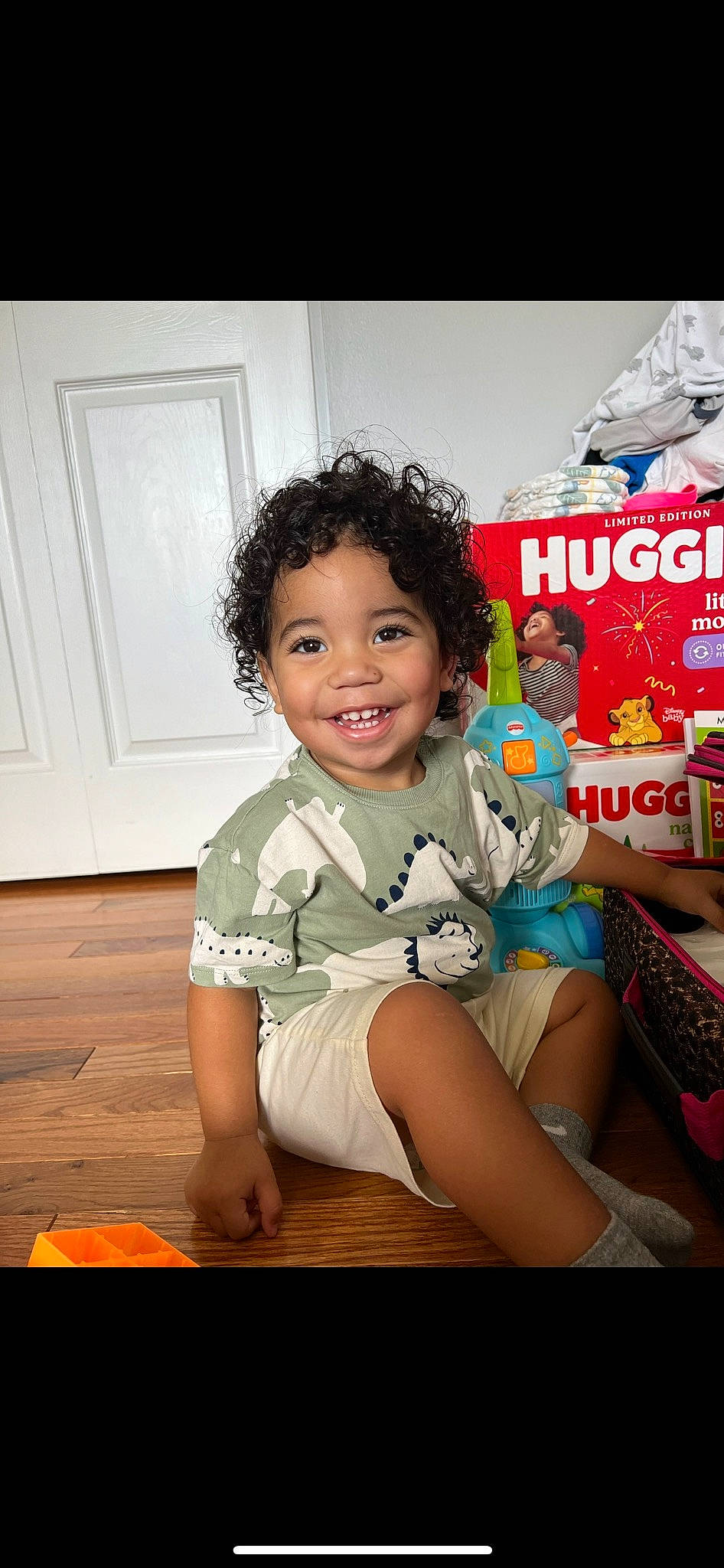 Karter joined the competition — help win amazing prizes! baby, baby_toddler_clothing, child, door, flash_photography, flooring, fun, happy, hardwood, human_leg, joy, lap, leisure, person, play, shorts, sitting, smile, t_shirt, thigh
