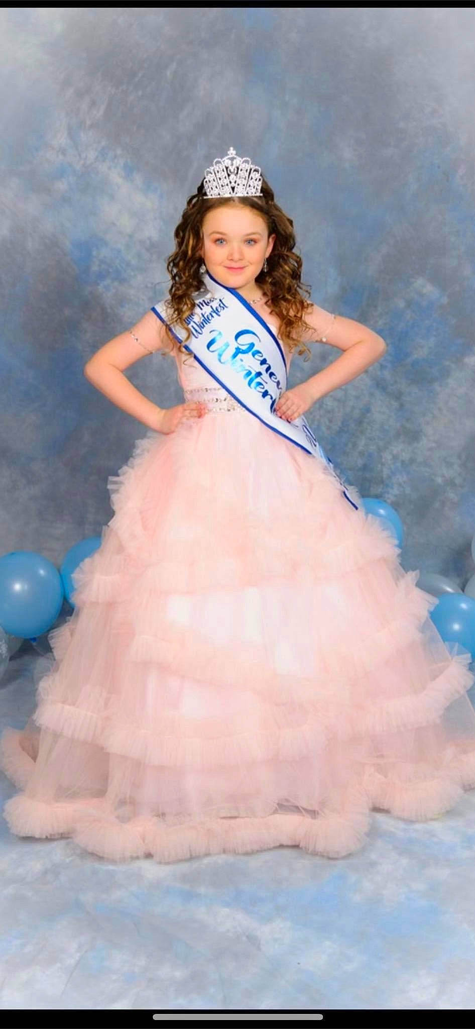 Angelina joined the competition — help win amazing prizes! blue, bridal_accessory, bridal_clothing, bridal_party_dress, day_dress, dress, embellishment, fashion_design, flash_photography, formal_wear, gown, happy, hat, headwear, joy, one_piece_garment, person, pink, ruffle, skin