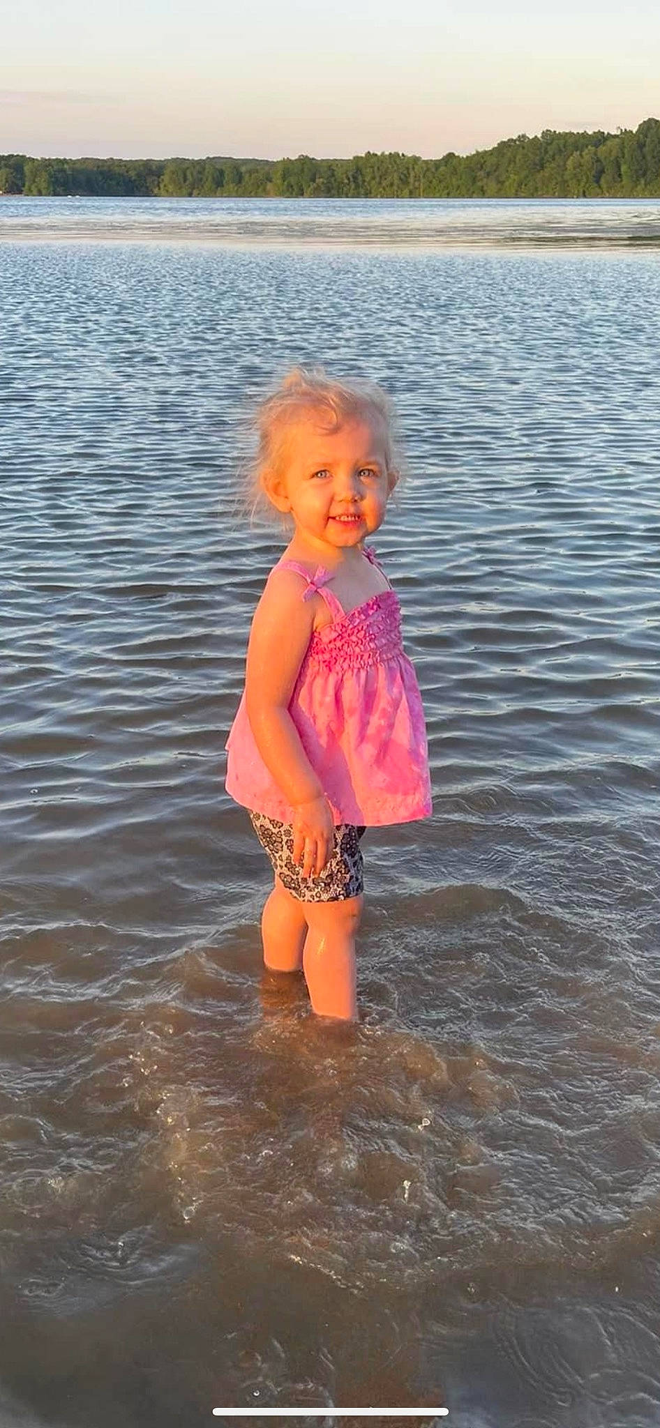 Lillyanna joined the competition — help win amazing prizes! baby_toddler_clothing, beach, child, coast, face, fun, happy, horizon, lake, morning, natural_environment, people_in_nature, people_on_beach, person, sand, shore, standing, sunlight, toddler, water