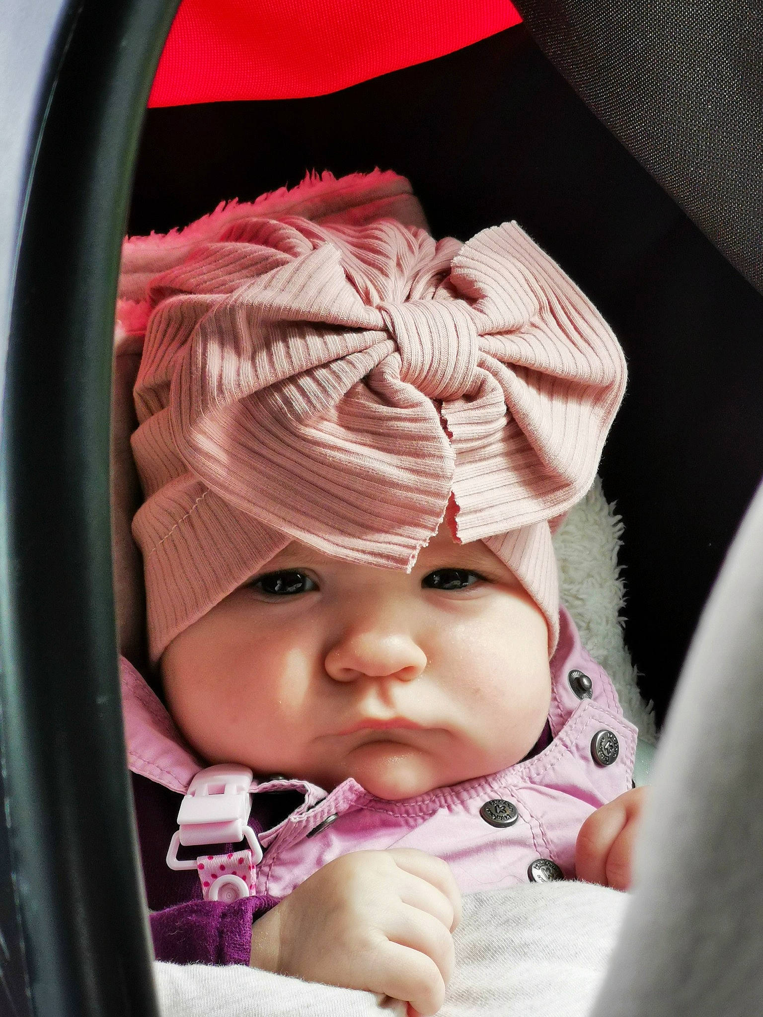 Ava participe au concours pour gagner de l'argent avec cette photo : baby, baby_carriage, baby_products, baby_toddler_clothing, cap, car_seat, cheek, child, comfort, finger, hand, hat, headwear, lip, magenta, mouth, person, pink, product, skin