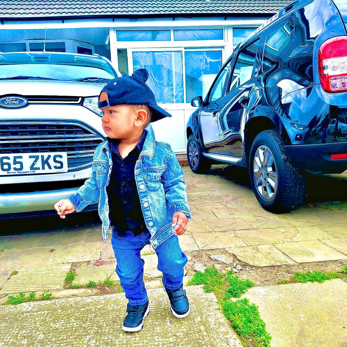 Hardik joined the competition — help win amazing prizes! building, cap, car, casual, child, clothing, concrete, denim_jacket, driveway, fashion, footwear, ford, grass, outdoor, person, sidewalk, street, toddler, urban, window