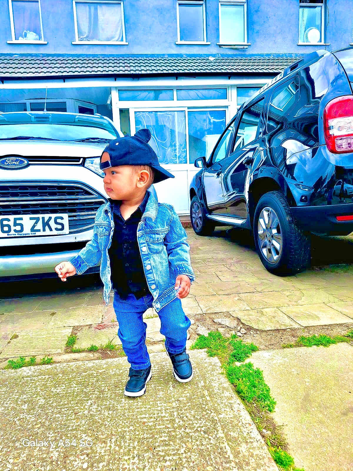 Hardik joined the competition — help win amazing prizes! building, cap, car, casual, child, clothing, concrete, denim_jacket, driveway, fashion, footwear, ford, grass, outdoor, person, sidewalk, street, toddler, urban, window