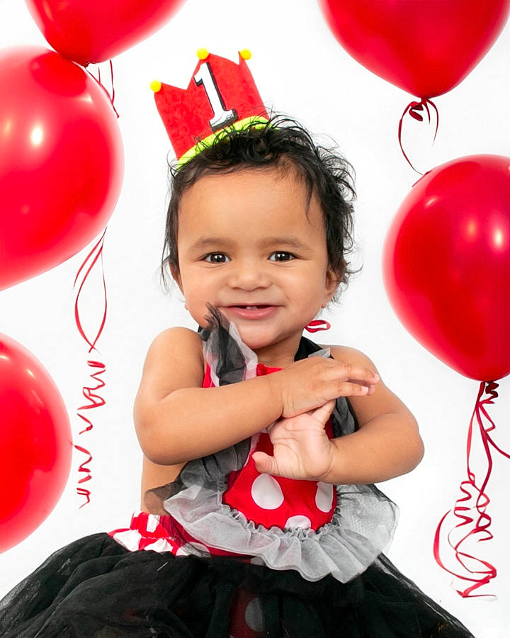Maddix joined the competition — help win amazing prizes! baby_toddler_clothing, balloon, facial_expression, flash_photography, fun, gesture, happy, human, joy, magenta, organ, party_supply, people, person, photograph, pink, red, sleeve, smile, standing