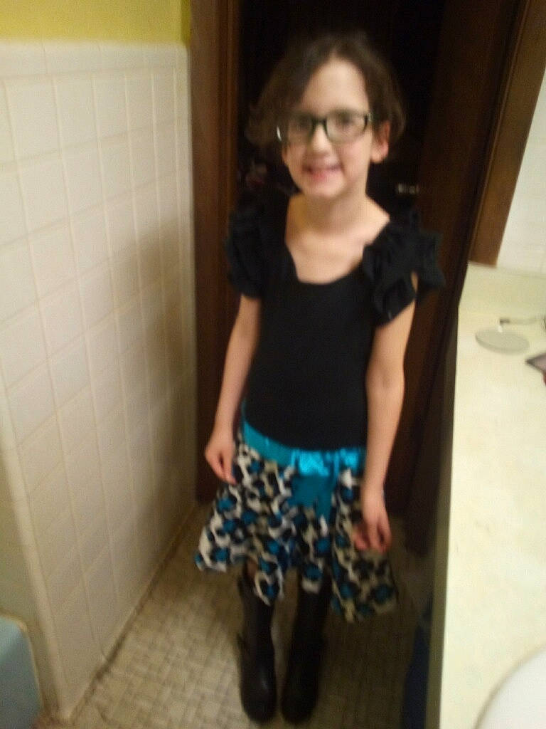 Dixie joined the competition — help win amazing prizes! child, clothing, dress, face, glasses, head, human_leg, joint, leg, long_hair, person, shorts, shoulder, skin, standing, t_shirt, thigh, tights, toddler, trunk