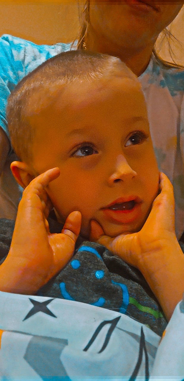 Corbin is registered to the contest to win money with this photo: blue, cheek, chin, ear, eyebrow, eyelash, finger, forehead, gesture, hand, happy, iris, lip, mouth, neck, nose, person, skin, smile, toddler