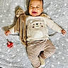 Noyer joined the competition — help win amazing prizes! baby, bear_design, blanket, child, clothing, comfortable, cozy, cute, happy, home, infant, laying_down, pacifier, person, plush_toy, portrait, smiling, soft_texture, striped_pants, sweater