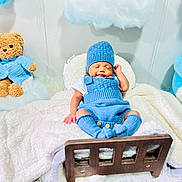 Noyer joined the competition — help win amazing prizes! baby, blanket, blue_alien_toy, blue_clothing, child, cozy, cute, indoor, infant, knitwear, nursery, peaceful, plush_toy, portrait, resting, sleeping, soft_toys, teddy_bear, white_blanket, wooden_bed