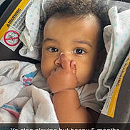 Janarious joined the competition — help win amazing prizes! baby, infant, car_seat, blanket, child, cute, curly_hair, hand, face, eyes, expression, indoors, seatbelt, clothing, newborn, portrait, person, cozy, love, milestone