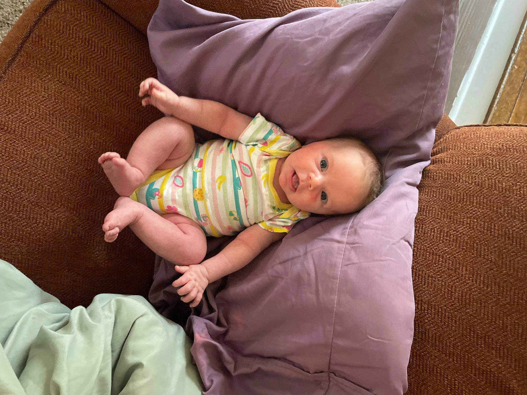 Lilyanna is registered to the contest to win money with this photo: baby, baby_toddler_clothing, bedtime, child, comfort, couch, foot, head, human_leg, knee, lap, linens, pattern, person, room, sitting, sleep, sock, thigh, toddler