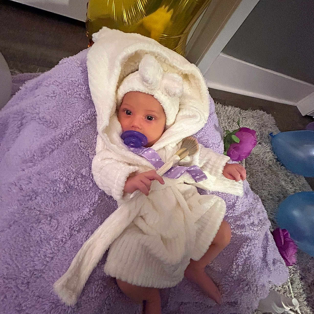 Hailie Rugg joined the competition — help win amazing prizes! baby, bed, bedroom, blanket, bonnet, clothing, face, furniture, hat, head, homedecor, indoors, newborn, person, photography, portrait, purple, quilt, room, towel