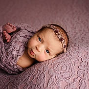 Maeve joined the competition — help win amazing prizes! newborn, baby, infant, portrait, wrapped, lace, purple, headband, flower, soft, texture, blanket, cute, puckered_lips, resting, closeup, skin, face, small_feet, sleepy