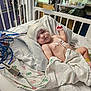 Chester is registered to the contest to win money with this photo: baby, hospital, crib, medical_equipment, blanket, bandage, electrodes, wires, infant, patient, healthcare, bed, monitoring, child, medical_care, resting, pediatric, cute, indoors, person