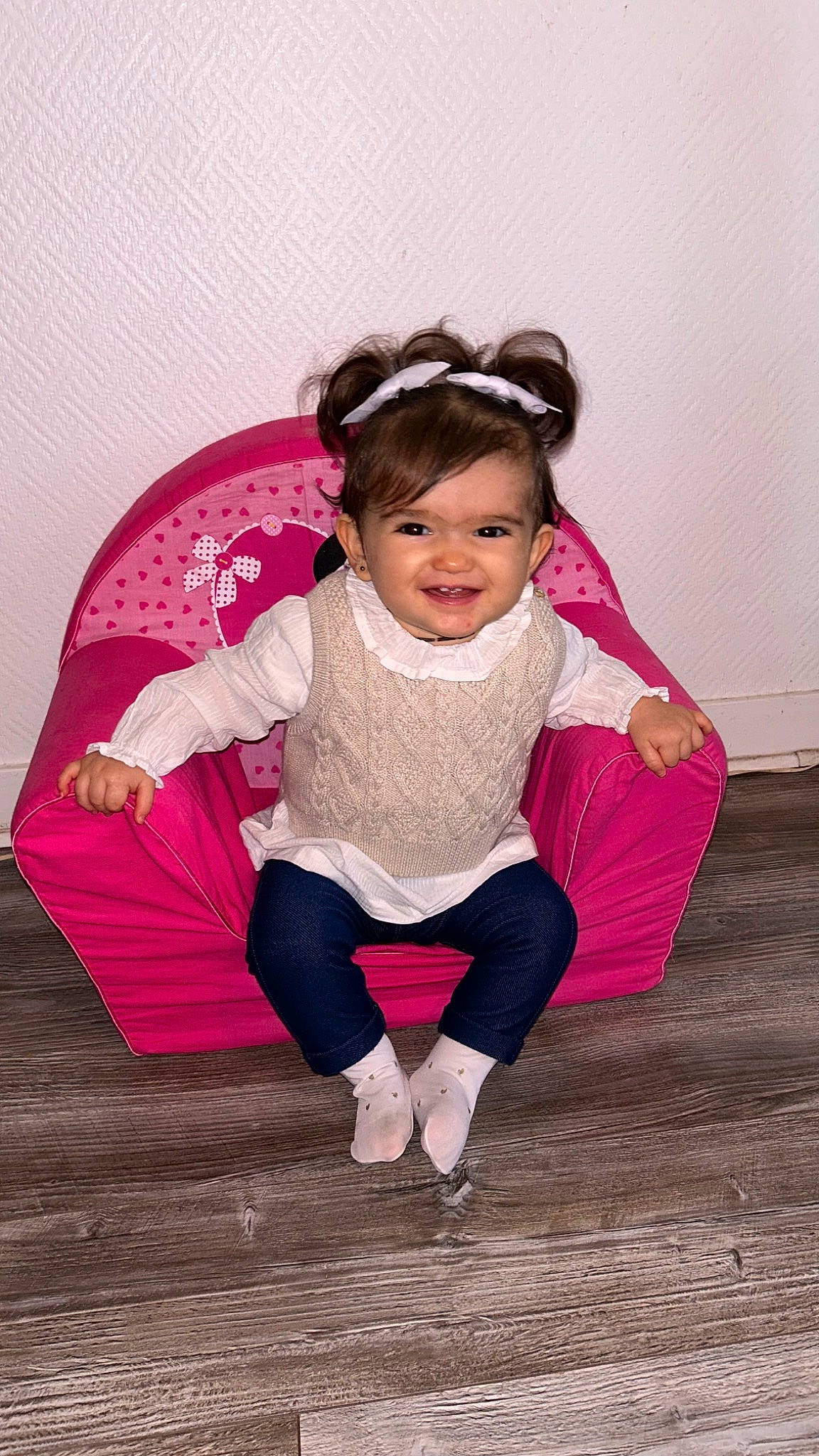 Mya participe au concours pour gagner de l'argent avec cette photo : baby_toddler_clothing, child, fashion_accessory, flash_photography, flooring, fun, happy, joy, leisure, magenta, outerwear, person, pink, purple, sitting, sleeve, smile, sock, textile, thigh