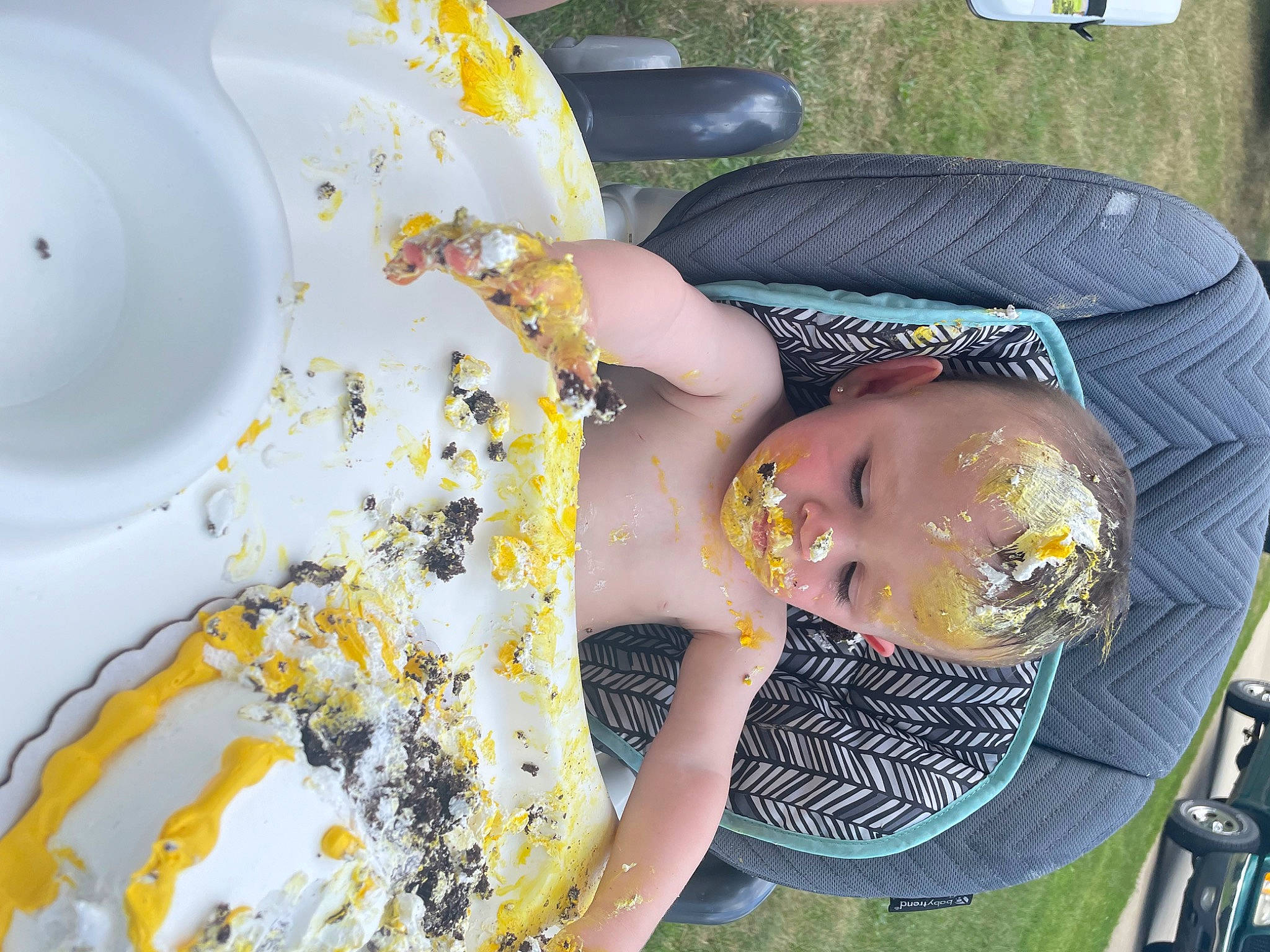 Brixton joined the competition — help win amazing prizes! baby, baby_toddler_clothing, chair, child, cup, dishware, drinkware, fun, grass, hat, pattern, person, plate, porcelain, serveware, sunglasses, tablecloth, tableware, thigh, toddler