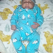 Ja'Cory joined the competition — help win amazing prizes! baby, sleeping, onesie, blue_clothing, hat, blanket, plush_toy, hand, infant, cozy, soft, pattern, indoor, resting, cute, child, person, warm, comfort, toddler