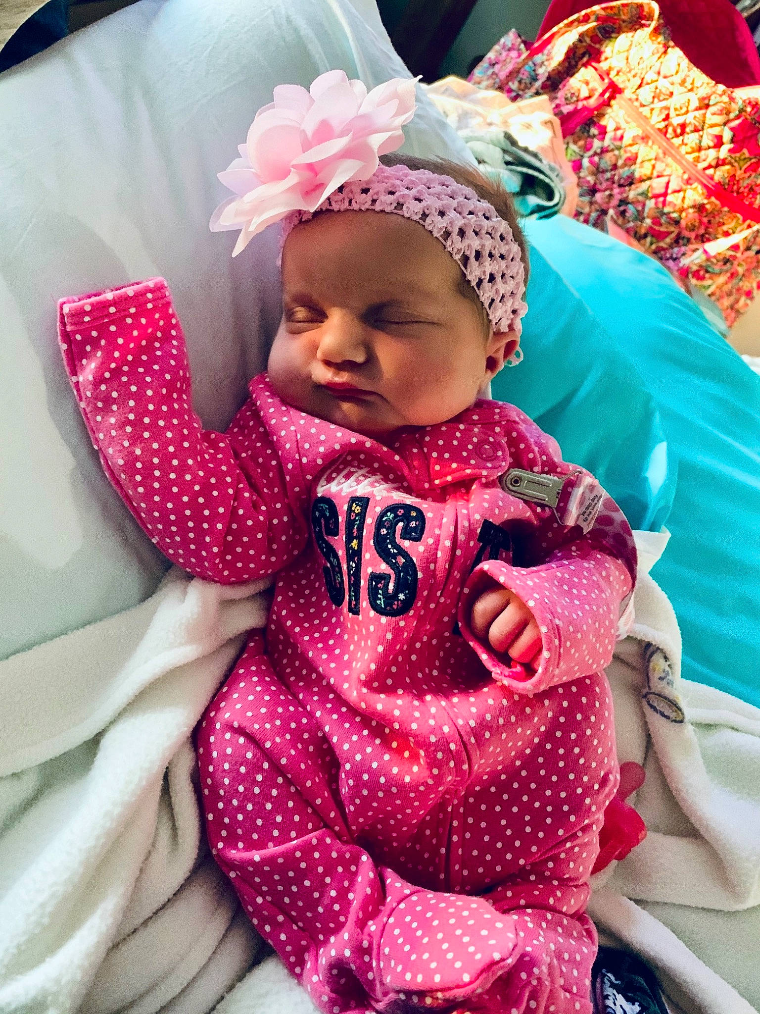 Elliana is registered to the contest to win money with this photo: baby, baby_products, baby_toddler_clothing, cap, cheek, child, comfort, fun, happy, headwear, linens, magenta, outerwear, pattern, person, pink, purple, skin, sleeve, smile