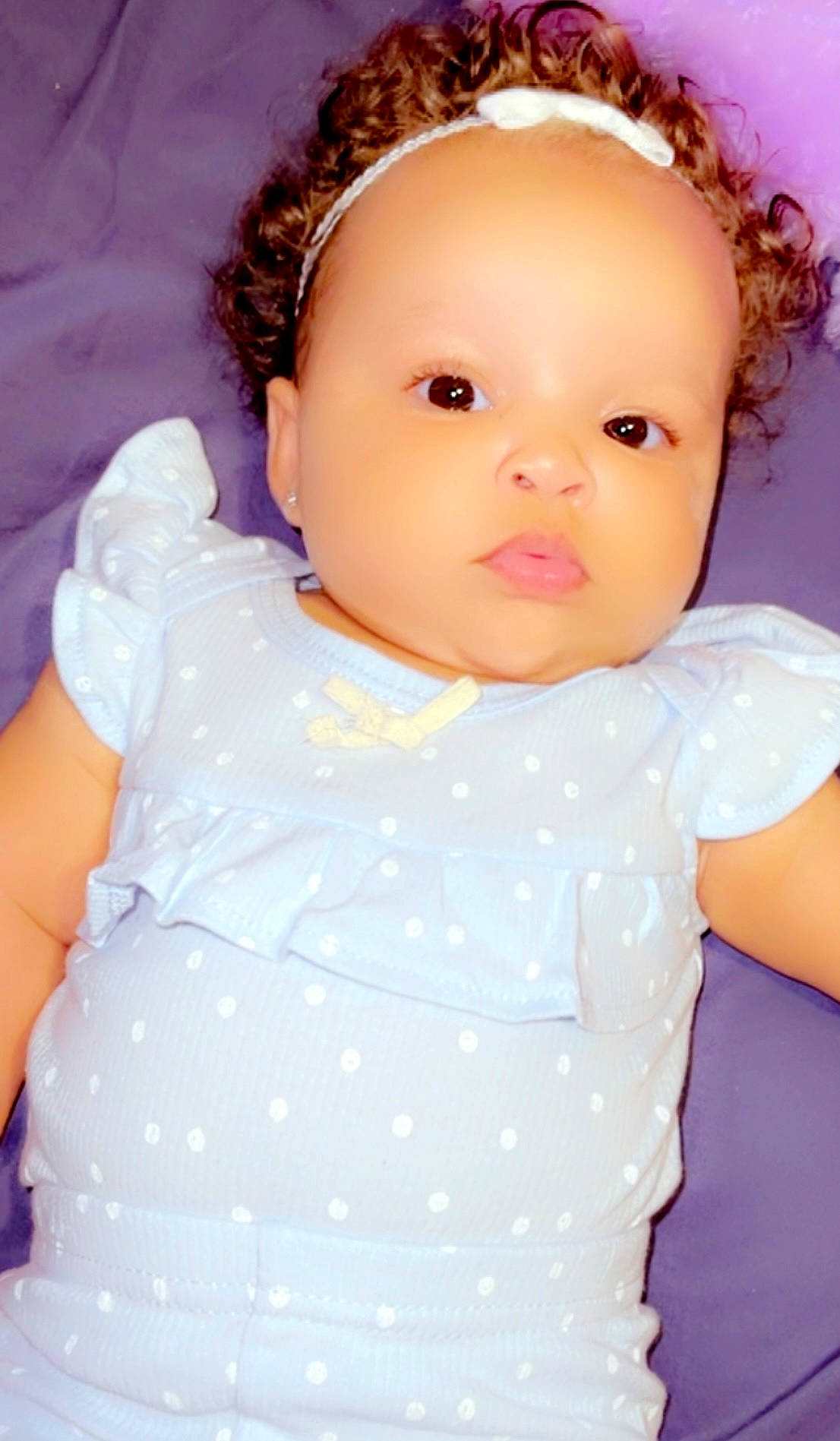 Jaliyah is registered to the contest to win money with this photo: baby, baby_toddler_clothing, brown_hair, cheek, child, day_dress, eye, eyebrow, eyelash, face, fashion_accessory, iris, lip, nose, pattern, person, pink, skin, sleeve, textile