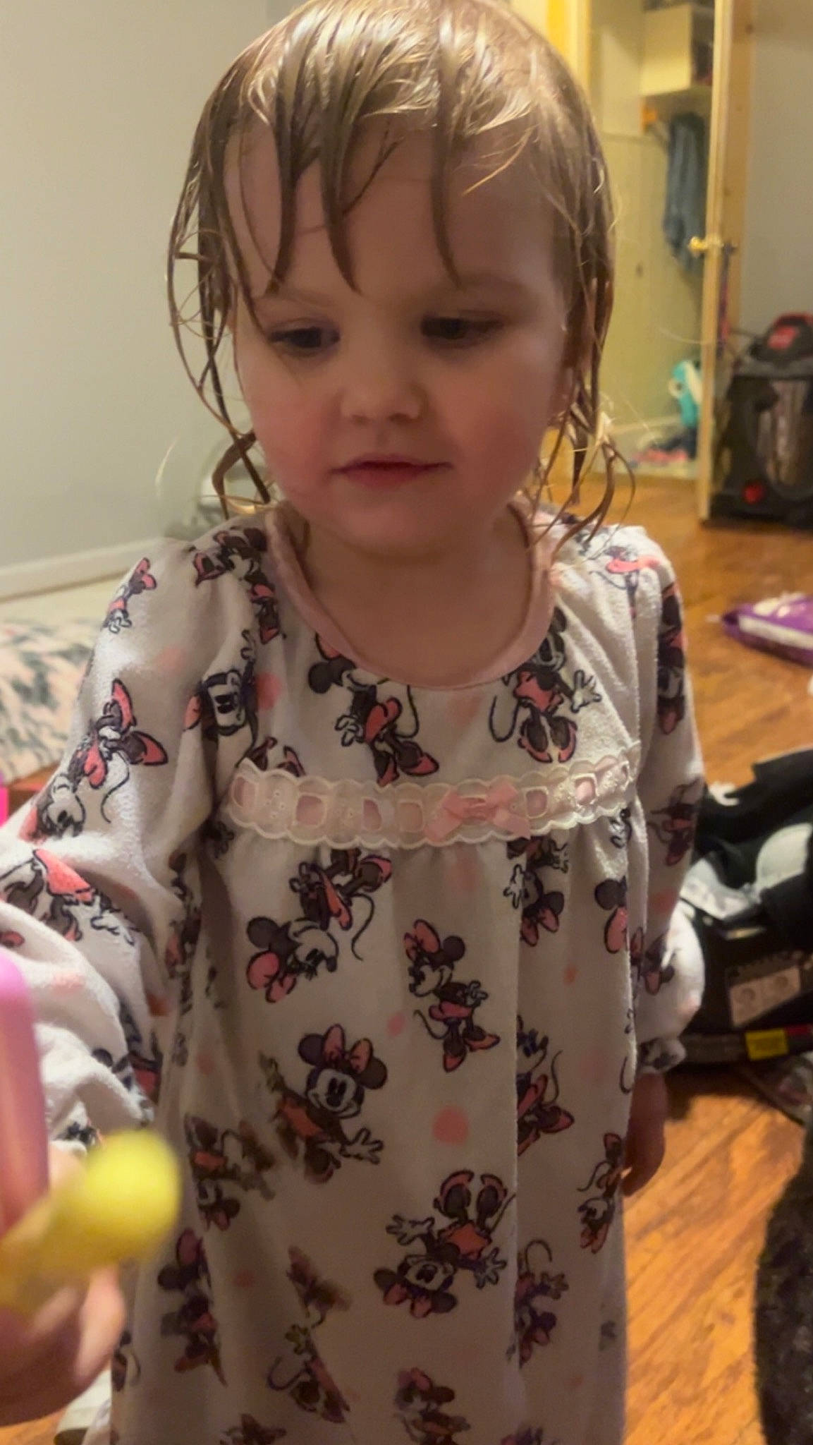 Leoline is registered to the contest to win money with this photo: audio_equipment, baby, baby_toddler_clothing, bangs, cheek, child, clothing, ear, eyelash, facial_expression, fun, nose, pattern, person, room, sitting, skin, sleeve, snapshot, t_shirt