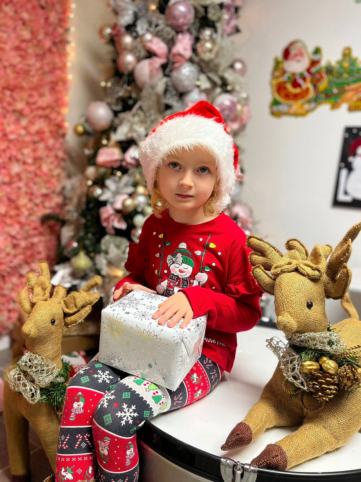 Agnes is registered to the contest to win money with this photo: baby, baby_toddler_clothing, child, christmas, christmas_decoration, christmas_eve, christmas_ornament, christmas_tree, dress, event, fun, happy, headwear, holiday, ornament, people, person, photograph, sleeve, smile