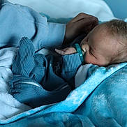 Carter joined the competition — help win amazing prizes! baby, blanket, blue_blanket, blue_outfit, child, closeup, comfort, cozy, cute, hand, indoors, infant, newborn, pacifier, peaceful, portrait, resting, sleeping, soft_texture, toddler