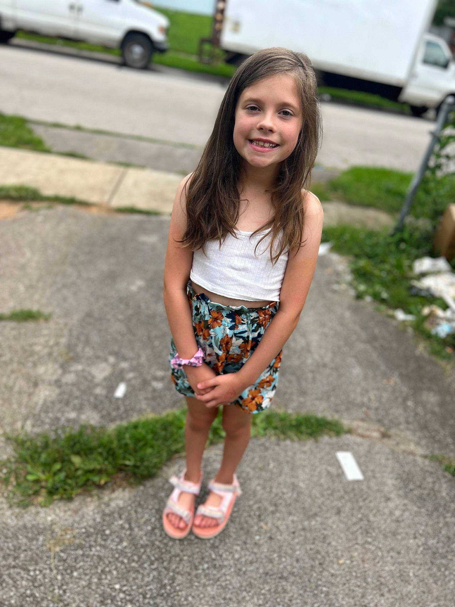 Piper is registered to the contest to win money with this photo: asphalt, car, electric_blue, fun, grass, hair, happy, human_leg, joy, knee, leisure, pattern, person, plant, road, road_surface, sidewalk, smile, summer, thigh