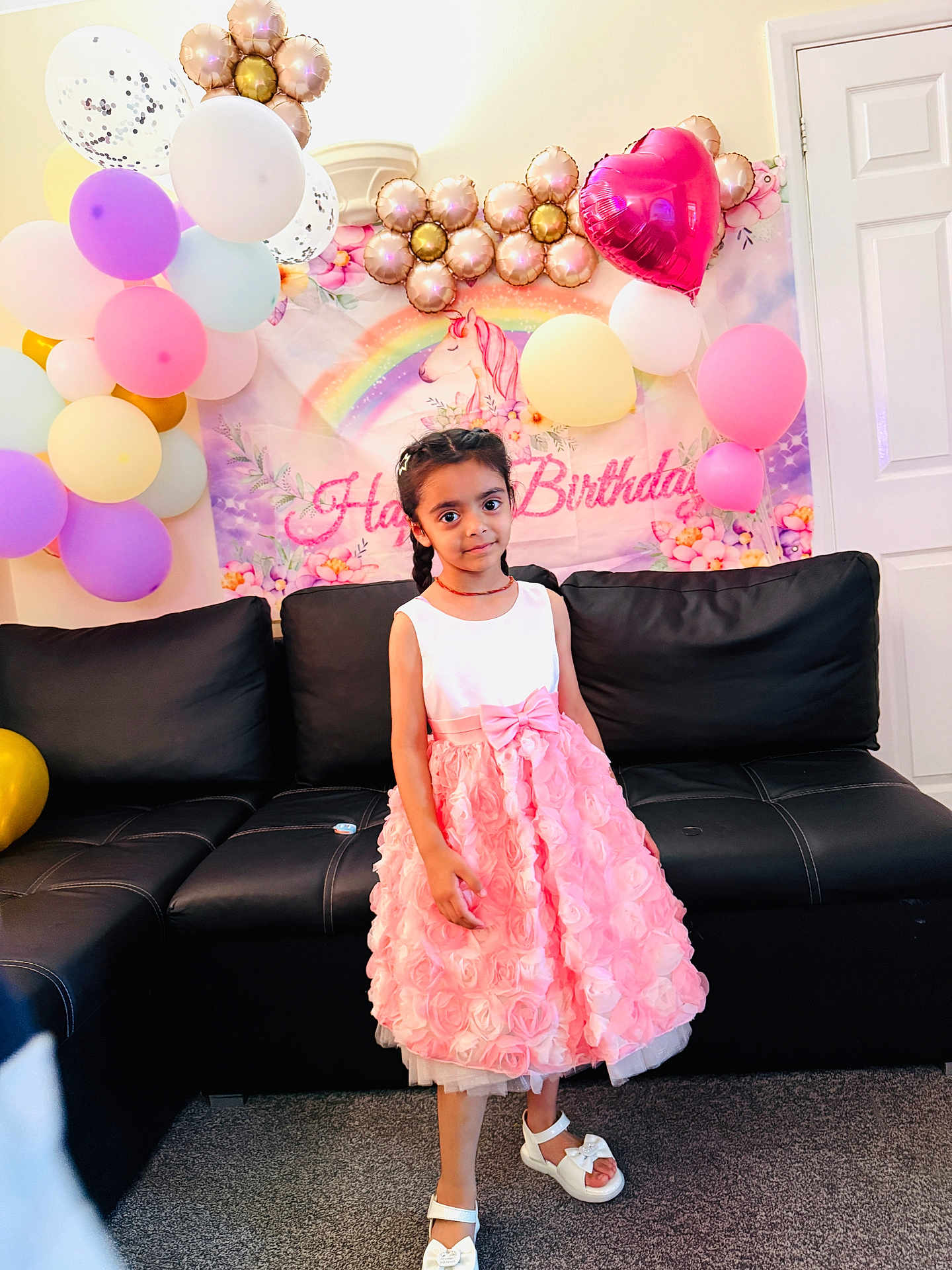 Manreet joined the competition — help win amazing prizes! child, girl, birthday, party, balloons, unicorn, rainbow, dress, pink, white, couch, carpet, indoors, celebration, smile, hair, footwear, decorations, wall, door