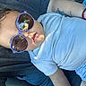 Kaleb joined the competition — help win amazing prizes! child, toddler, sunglasses, purple_sunglasses, white_shirt, person, face, reflection, indoor, casual_clothing, tattoo, arm, relaxed, seated, comfort, light, shadow, photography, portrait, cute