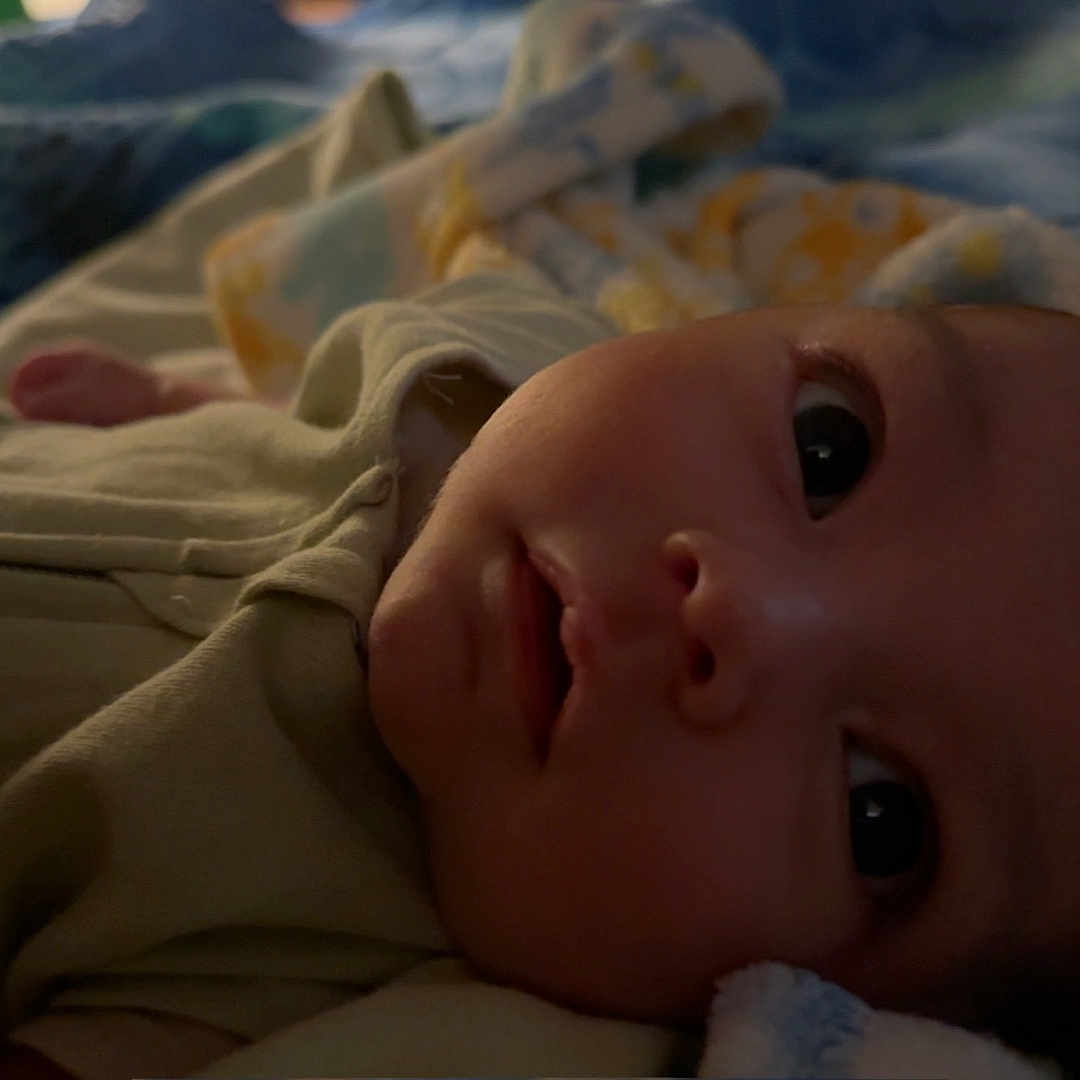 Kaleb joined the competition — help win amazing prizes! baby, bed, blanket, bodypart, bonnet, clothing, couch, face, finger, furniture, hand, hat, head, homedecor, newborn, person, photography, portrait, quilt, towel
