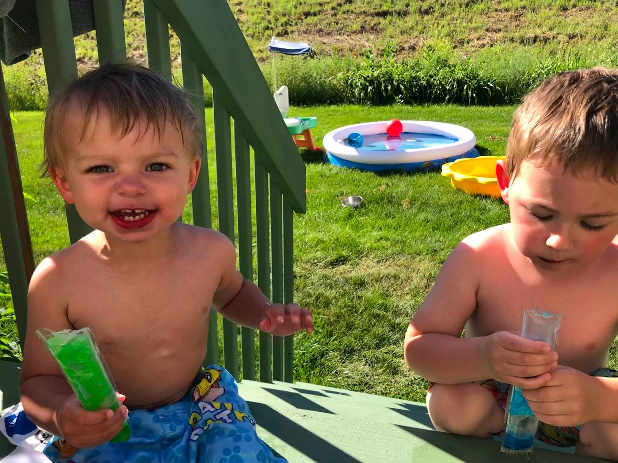 Brooks joined the competition — help win amazing prizes! baby, baby_toddler_clothing, blue, child, face, fun, grass, green, happy, joy, leisure, outdoor_furniture, people_in_nature, person, play, recreation, sharing, smile, summer, table