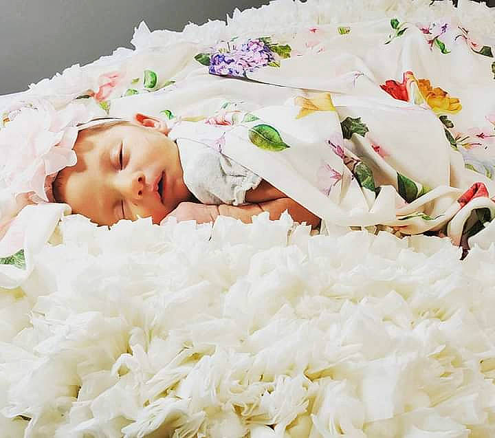Delaney is registered to the contest to win money with this photo: baby, basmati, child, cuisine, dish, dress, flower, food, jasmine_rice, person, petal, plant, rice, smile, steamed_rice, white_rice