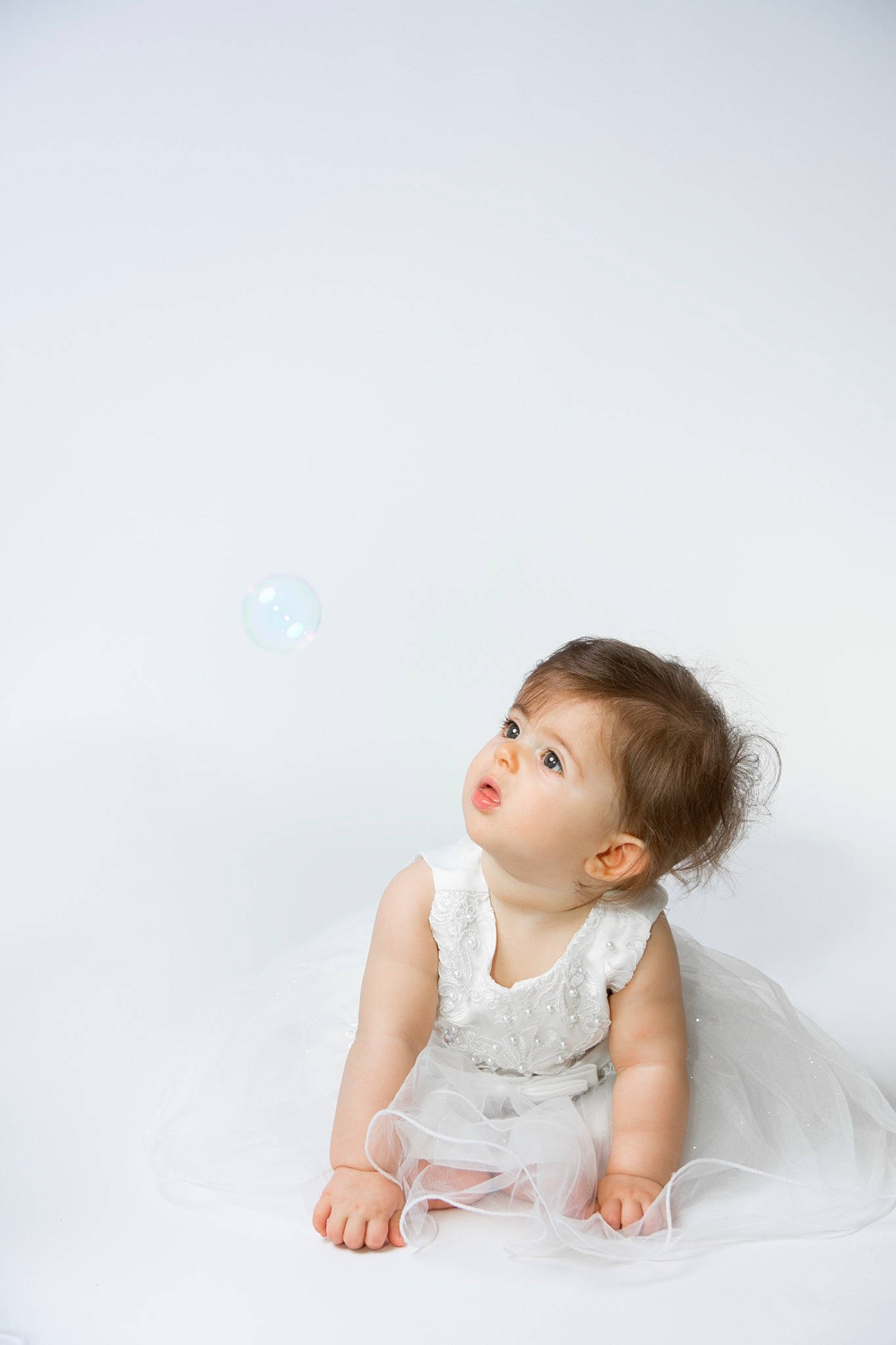 Krystale participe au concours pour gagner de l'argent avec cette photo : baby, child, dress, eye, person, photo_shoot, photograph, photography, pink, portrait, portrait_photography, sitting, skin, toddler, white