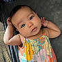 Nevaeh joined the competition — help win amazing prizes! baby, infant, child, face, portrait, colorful_clothing, floral_pattern, arms_up, lying_down, quilted_surface, relaxed, cute, indoors, closeup, skin, expression, big_eyes, summer, soft_light, casual