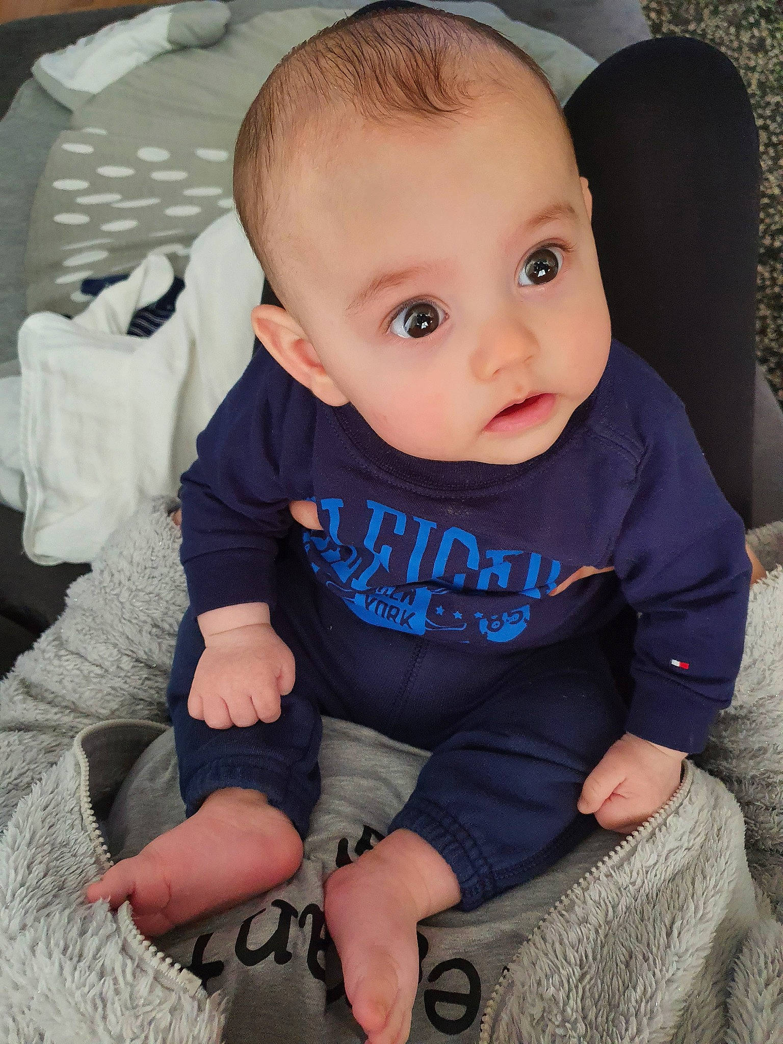 Gustavo is registered to the contest to win money with this photo: baby, baby_products, baby_toddler_clothing, cheek, child, chin, ear, eye, face, forehead, head, iris, lip, nose, person, product, sitting, skin, sleeve, smile