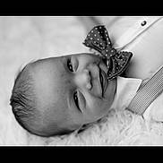 Kasen joined the competition — help win amazing prizes! baby, infant, smile, face, bow_tie, black_and_white, portrait, close_up, clothing, suspenders, cute, happy, lying_down, fluffy_surface, head, skin, young_child, one_person, indoors, monochrome