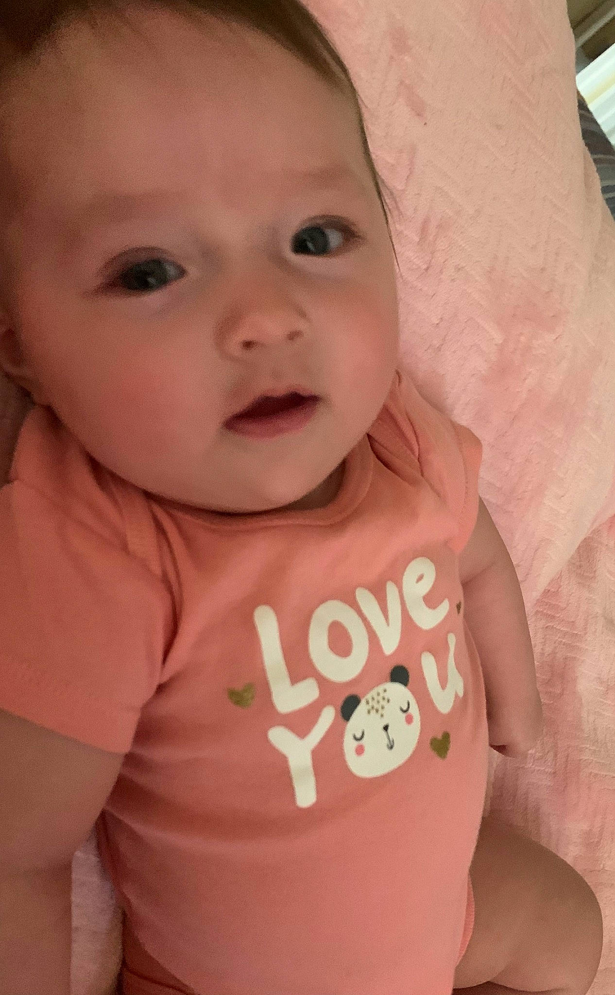 Kylie is registered to the contest to win money with this photo: arm, baby, baby_toddler_clothing, cheek, clothing, eyelash, face, facial_expression, finger, gesture, happy, head, iris, lip, mouth, neck, nose, person, skin, sleeve