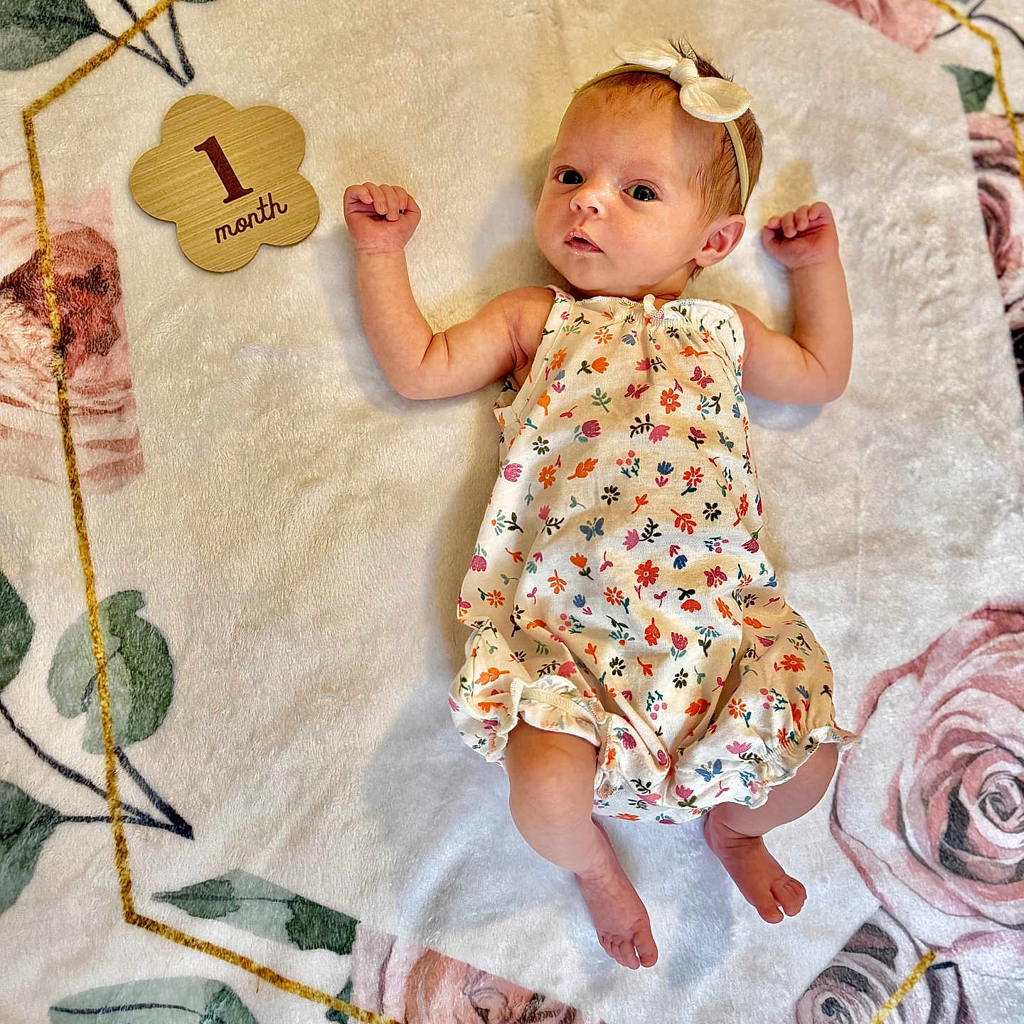 Emery joined the competition — help win amazing prizes! baby, baby_girl, child, curious_expression, cute_outfit, decorative_blanket, floral_blanket, headband, indoors, infant, light_skin, lying_down, newborn, one_month, peaceful, portrait, raised_arms, sleepwear, small_feet, soft_texture