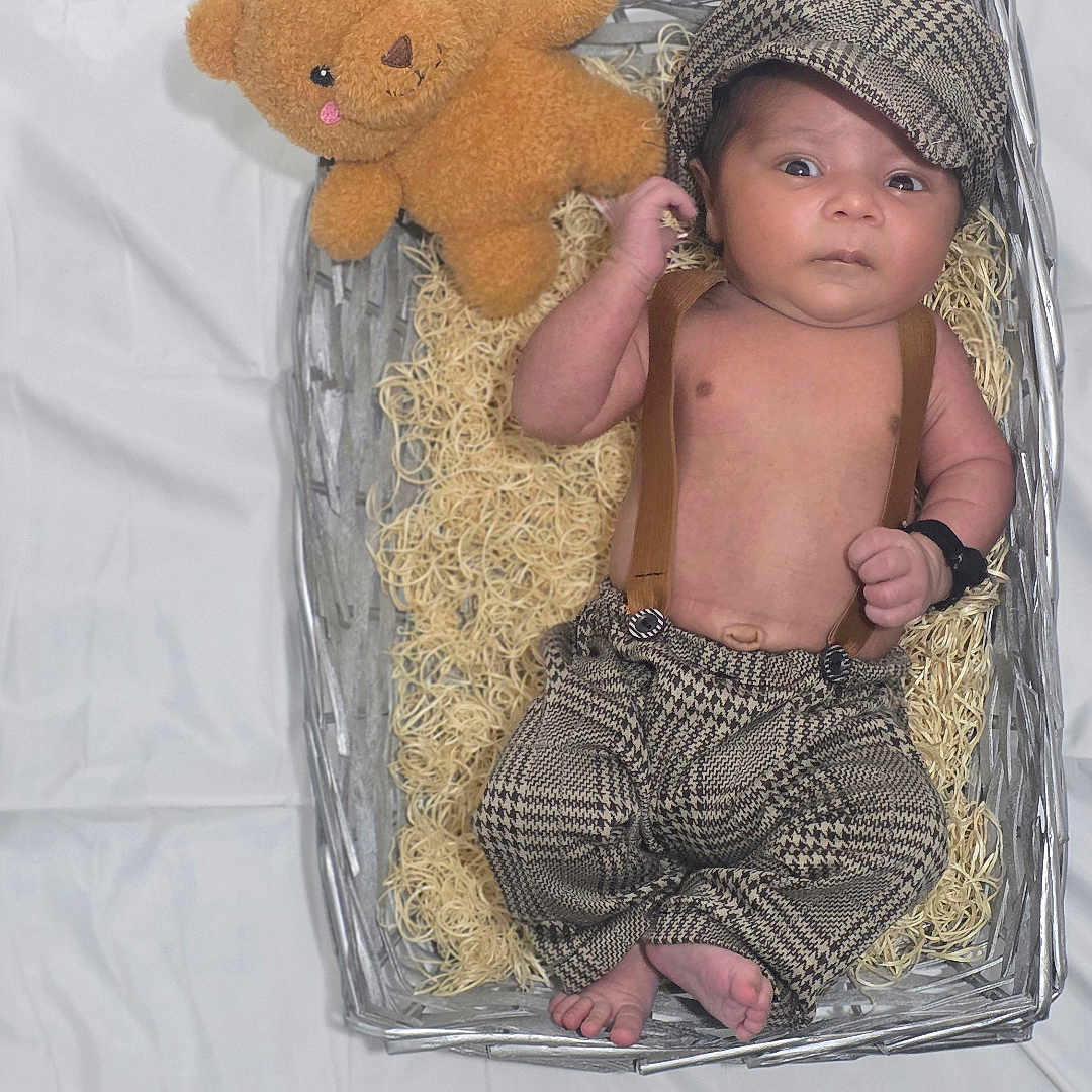 Evaan joined the competition — help win amazing prizes! baby, basket, blanket, clothing, comfort, cute, expression, fabric, face, feet, hand, hat, indoor, infant, newborn, portrait, soft_toy, suspenders, teddy_bear, toy